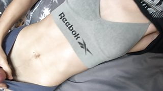 Boy in crop top and sports bra