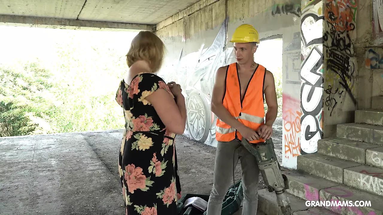 Fat granny gives head and titjob to construction worker photo