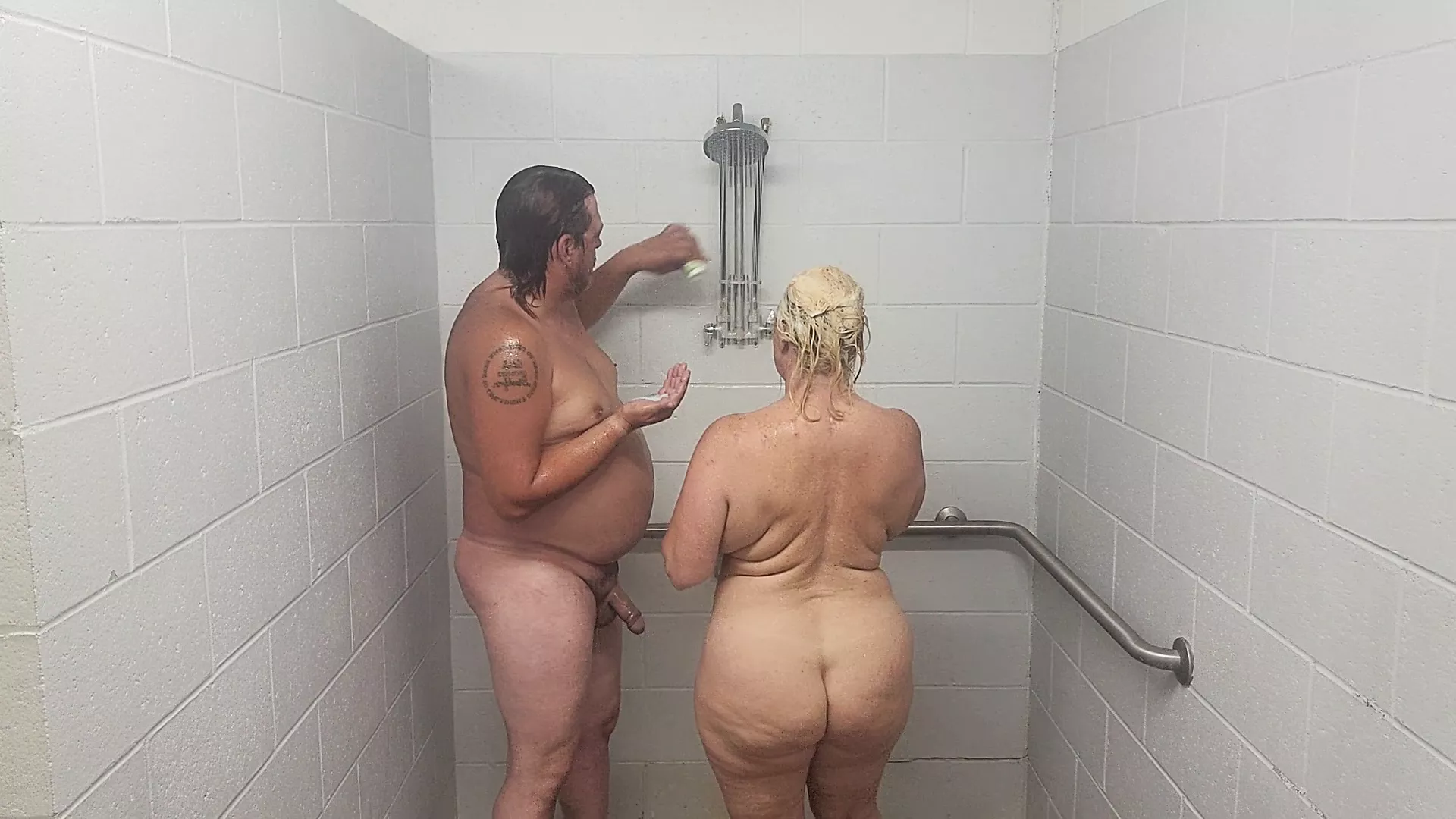 Husband and wife taking a shower with a quickie image