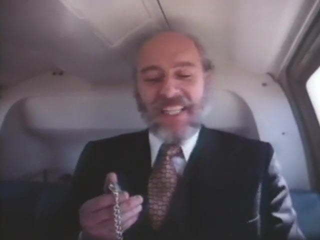 Old Bearded Man In A Suit Getting Head In A Helicopter