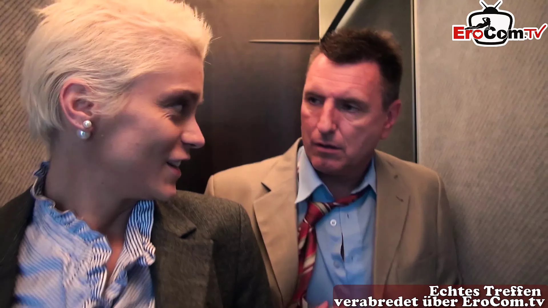 German blonde MILF with big tits and short hair does anal in an elevator pic