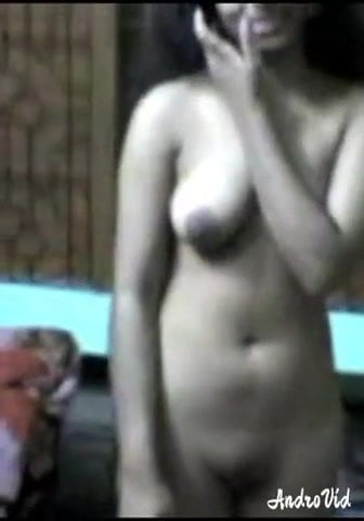 Shy Older Woman Standing Naked