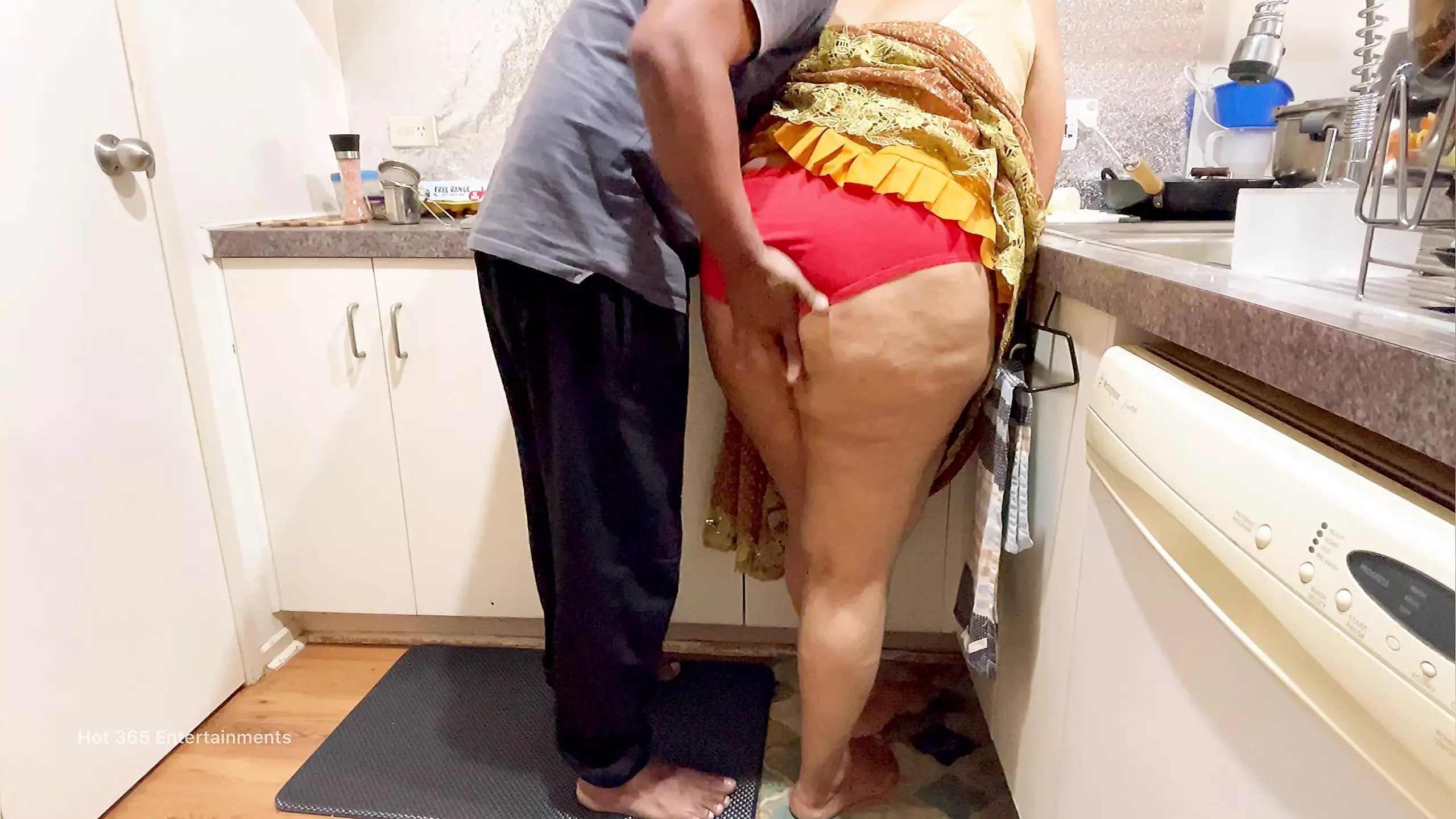 Indian Couple Romance In The Kitchen - Saree photo image
