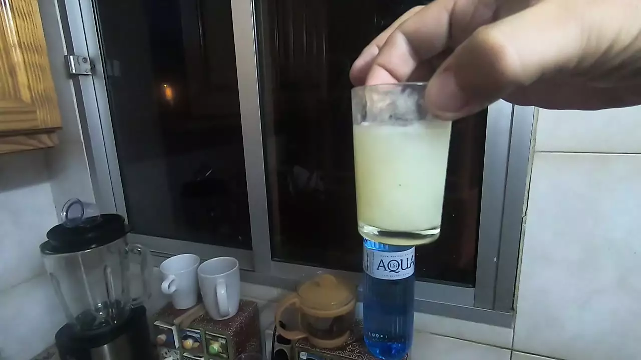 Girlfriend drinks a lots of saved cum from a shot glass photo