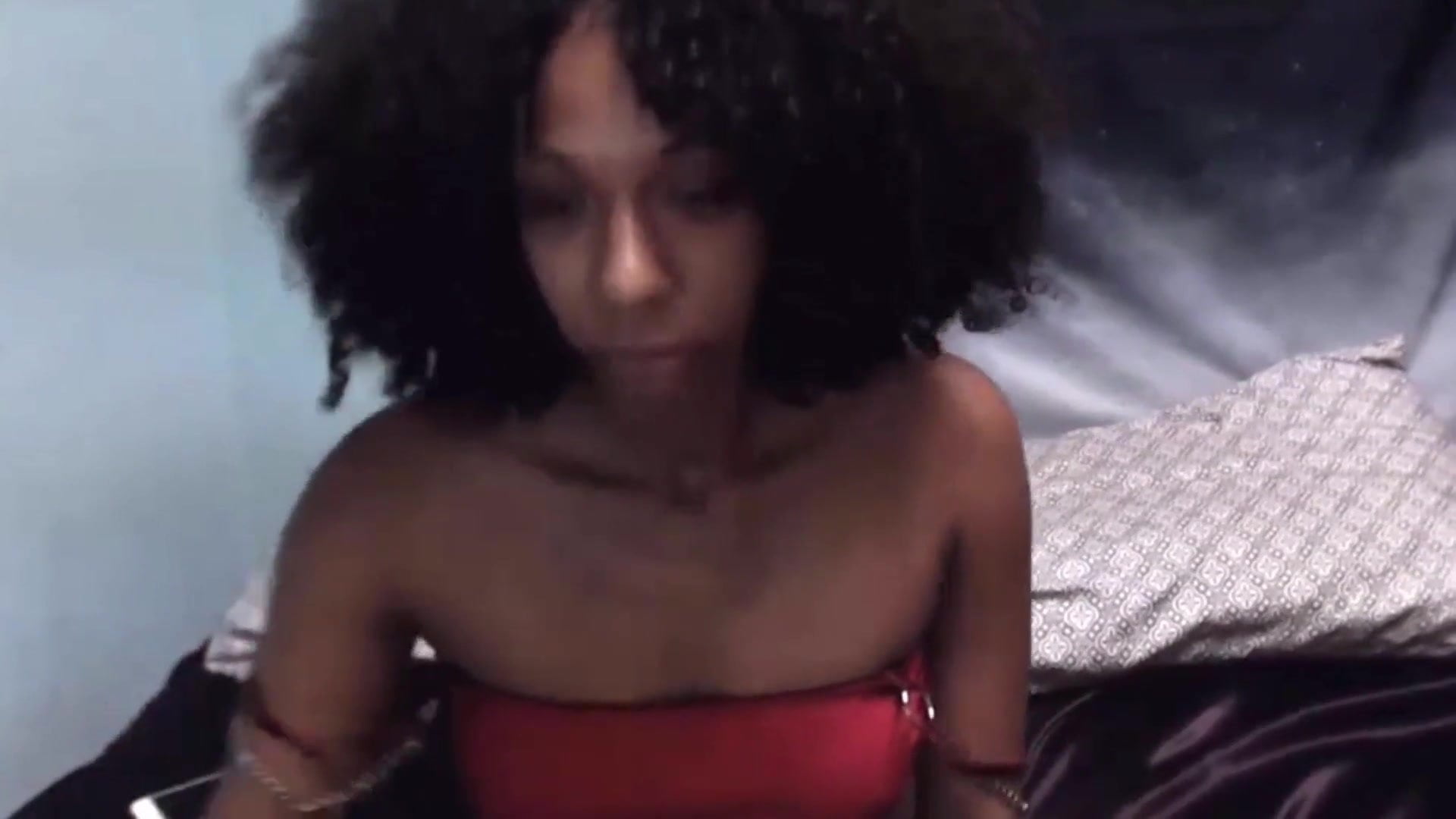 Ebony curly playing with herself