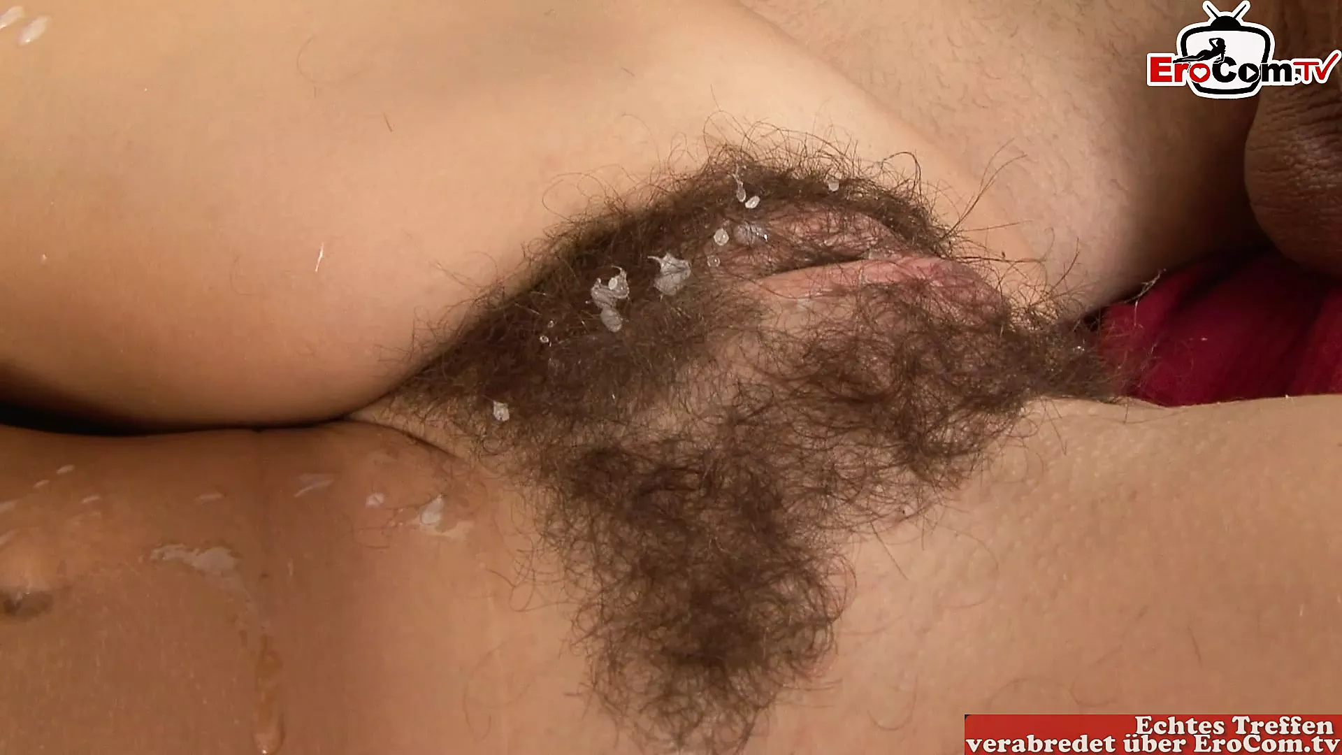 Brunette with small tits gets a cumshot on her hairy pussy picture