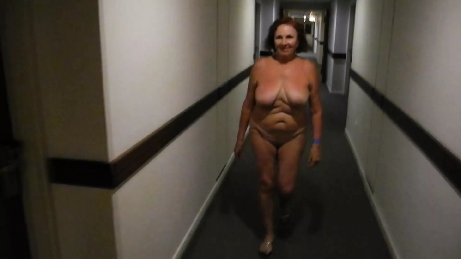 Dance and walk of a naked mature woman