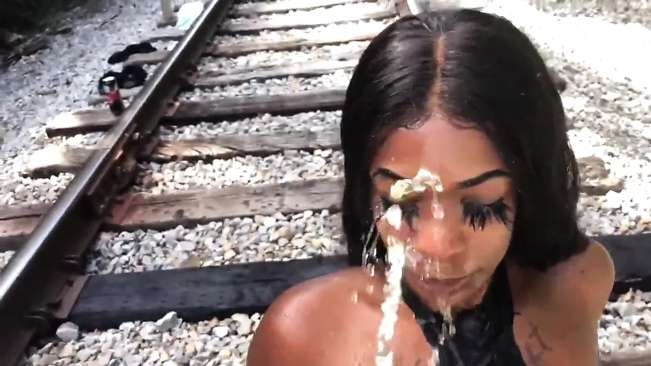 Ebony slut has an outdoor golden shower picture